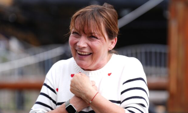 Lorraine Kelly speaks to the media after ascending the mast of the RRS Discovery in Dundee.