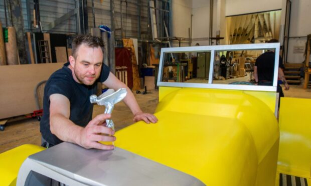 CR0052927 - Rebecca Baird Story - Perthshire area  - Photo essay style piece - behind the scenes at Pitlochry Festival Theatre's scenery and costume workshop - Picture shows Colin Stephen (Senior Carpenter) places the hood ornament for the car made for The Great Gatsby -- Pitlochry Festival Theatre,  Port-Na-Craig Rd, Pitlochry - Thursday 1st May 2025  - Image: Steve MacDougall/DC Thomson