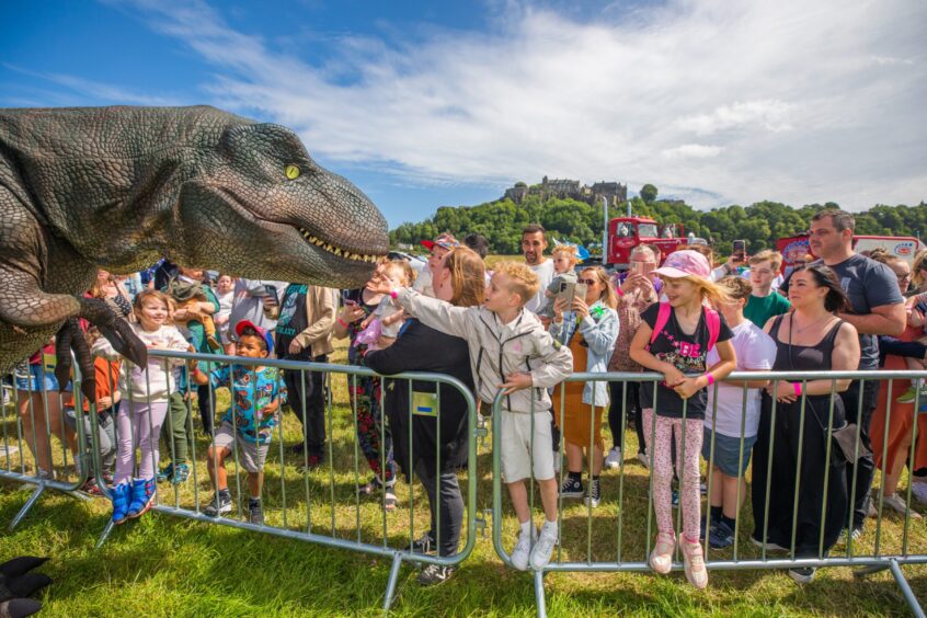 T-Rex meets the crowds at the Big Summer Spectacular.
