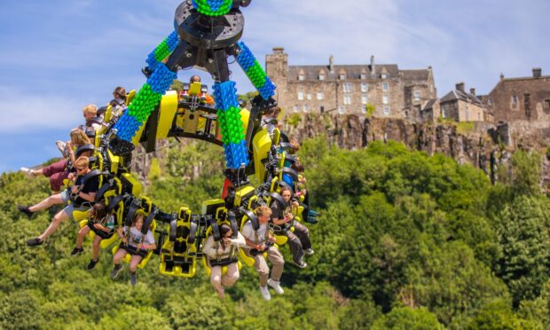 Visitors enjoy the fairground rides with Stirling Castle as a 'spectacular' backdrop.  Image: Steve MacDougall/DC Thomson
