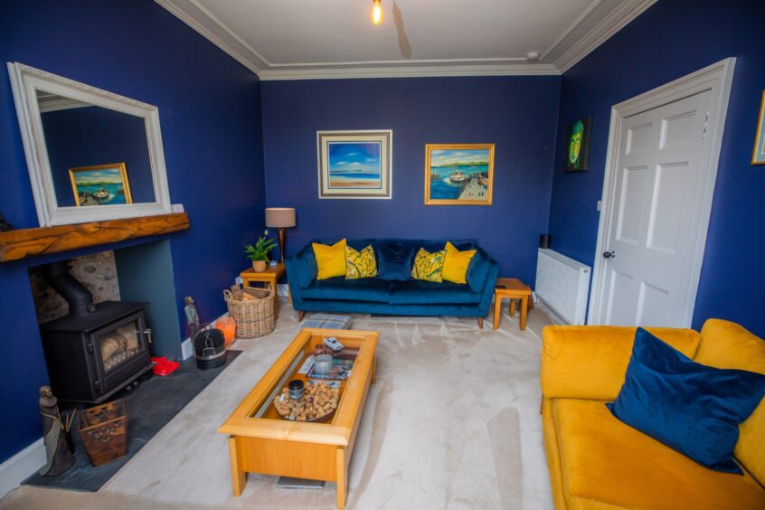 The dark blue living room