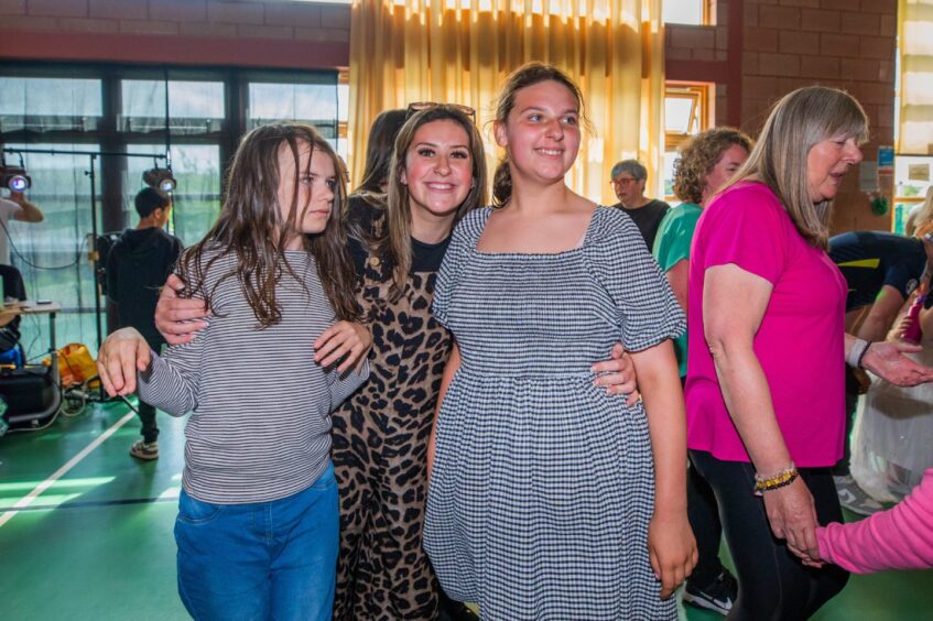 Female party-goers on the dancefloor. 