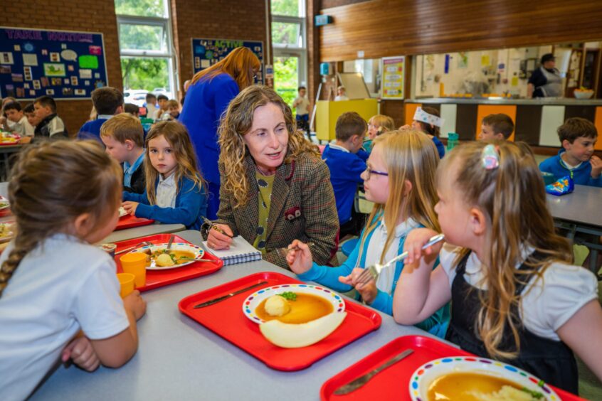 The girls are eager to tell me how good Fife school dinners are.