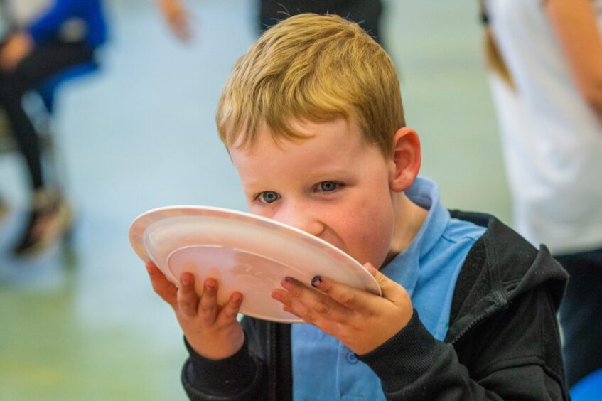 Thomas licks his plate clean.