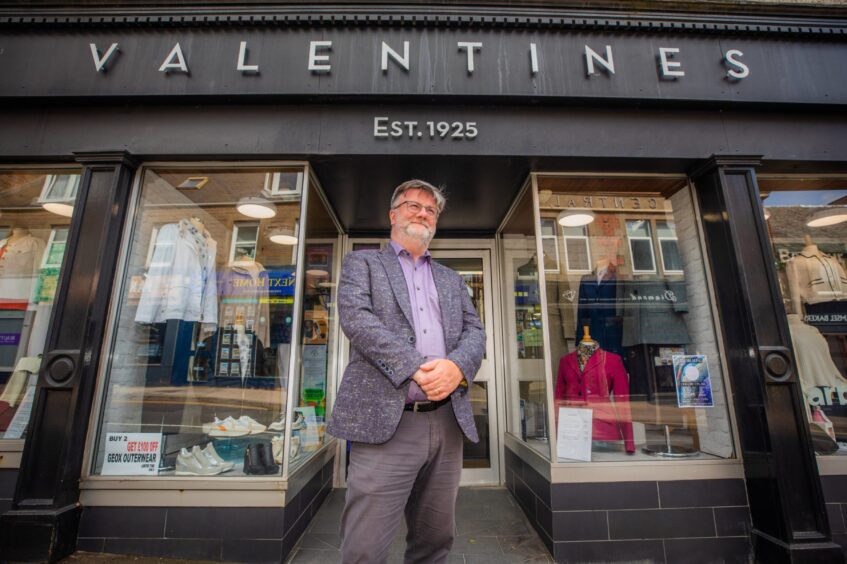 David Agnew outside the shop.