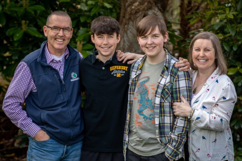Aaron with his family - dad Lucas Jan Berghuis, brother Elliot and mum Marianne at home in Fife.
