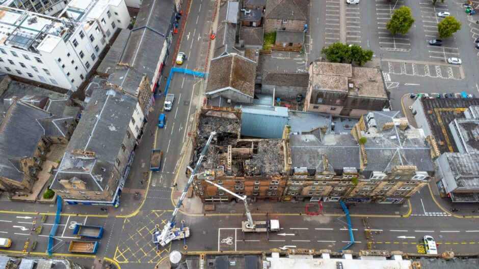 Drone footage shows the roof of the building was destroyed by the fire in Perth. 