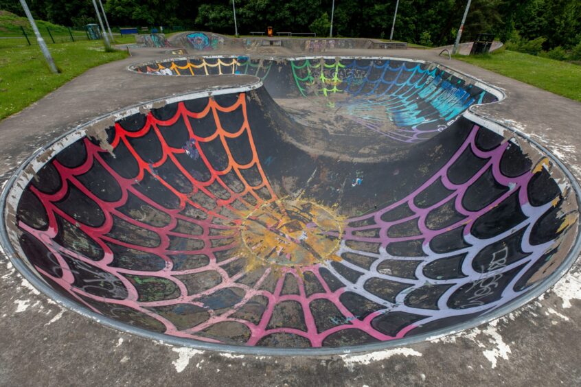The Riverside Park skateboard bowl, painted like a spider's web