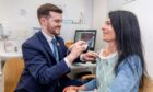 Gayle has a mole scanned by pharmacist Andrew Geekie at Boots in Dundee.