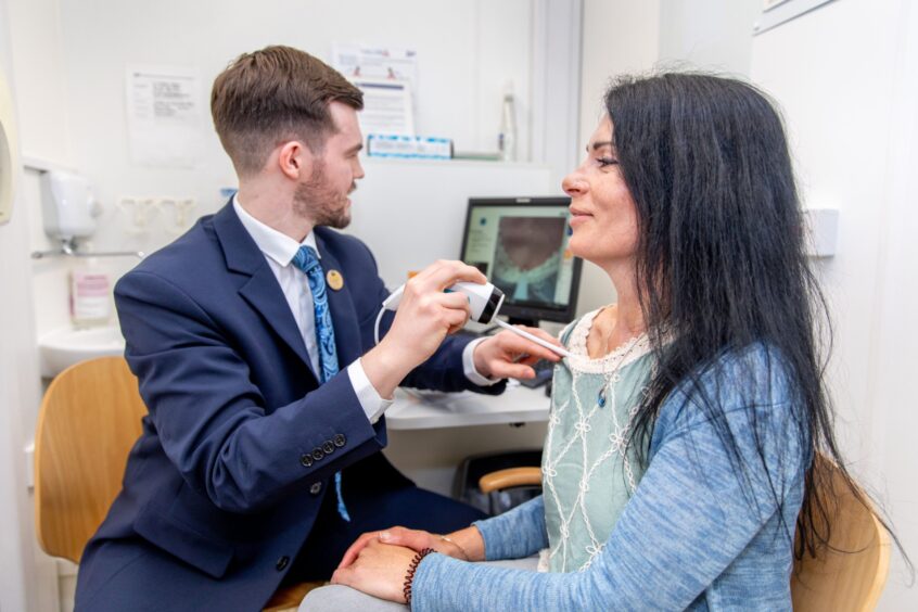 Andrew scans one of Gayle's moles.