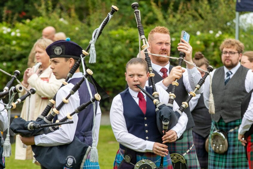 Youngsters from Burntisland &amp; District Pipe Band warm up.