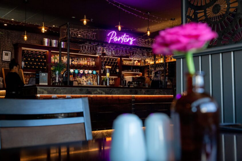 A view of the dark wood bar in the restaurant.