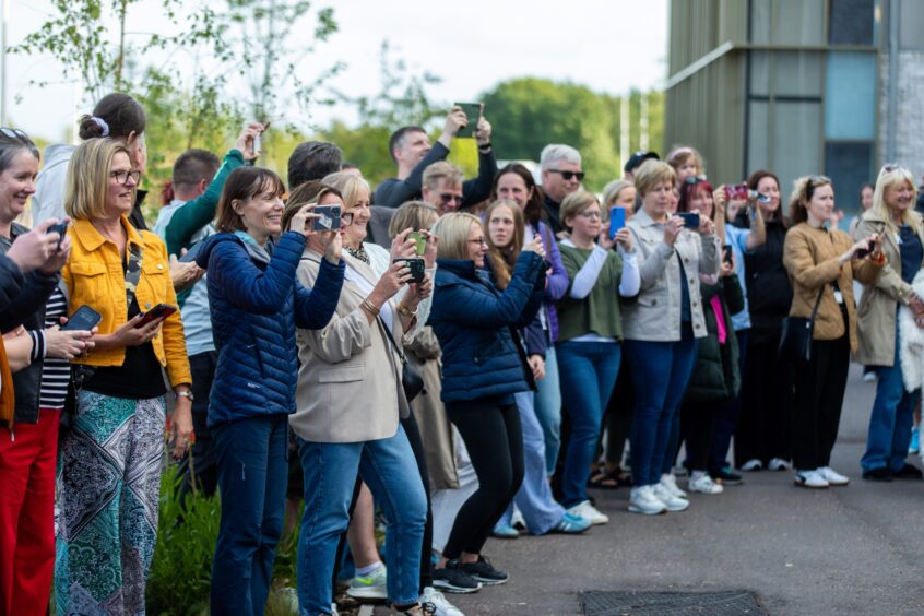 Parents taking pictures of their children