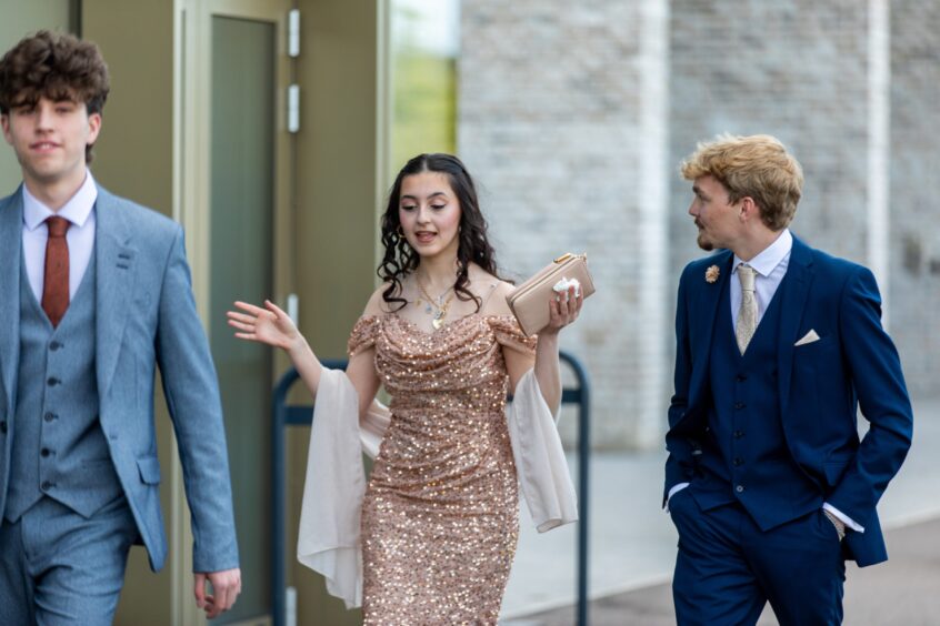Three pupils arrive at the event