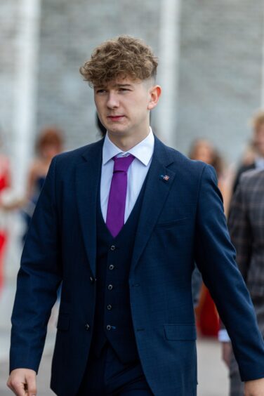 A young man walks in