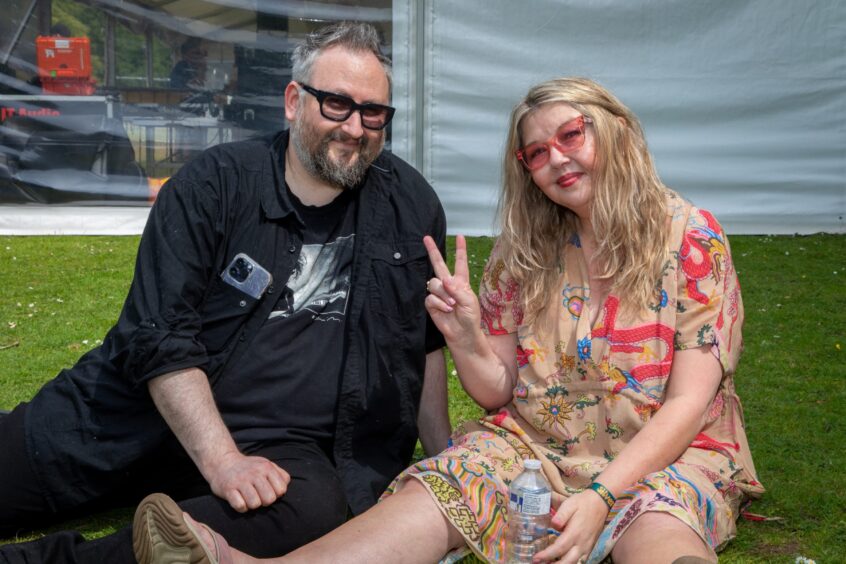 James and Joanna from Leven celebrating their 25th Anniversary. Both smile as Joanna gives a peace sign.
