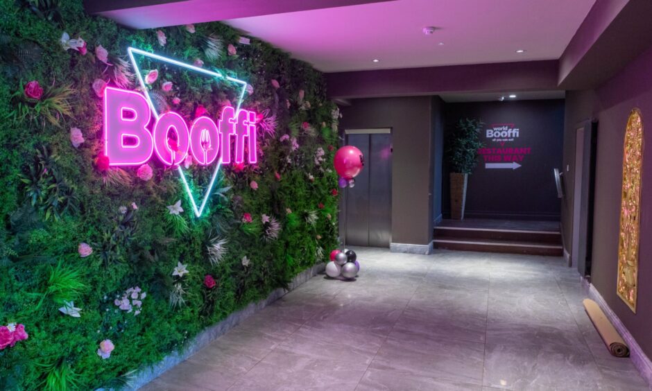 The foyer at Booffi World Buffet in Dunfermline, complete with a neon sign.