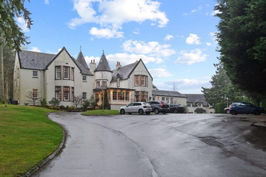 Cairn Lodge and its car park