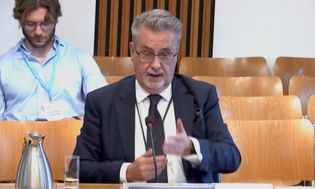 Former Dundee University principal Iain Gillespie at Holyrood. Image: Scottish Parliament TV