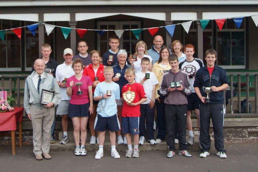 Colin Baxter with club trophy winners and members in 2005. 