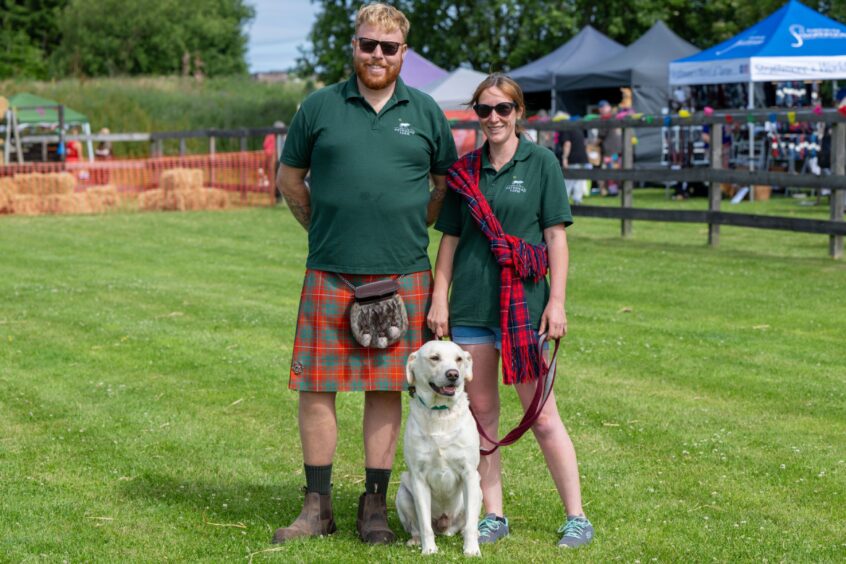 Obi with owners Alan Bruce and Laura Gow of Pathhead.