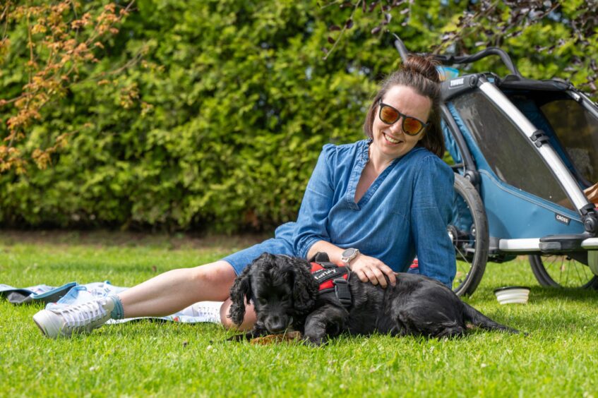 Harris and owner Caroline Hodson relaxing in the Kirrie sunshine.