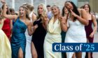 girls in prom dresses pose for a picture