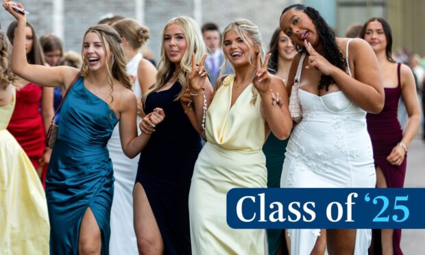girls in prom dresses pose for a picture