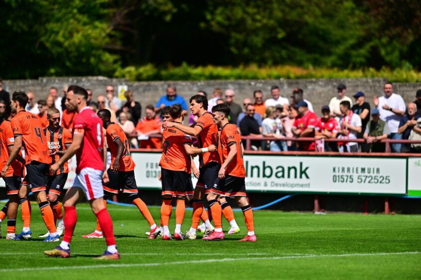 The United players celebrate the opener.
