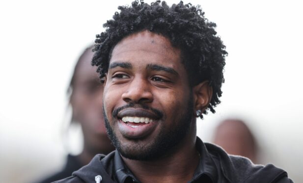 Andre Raymond smiling.