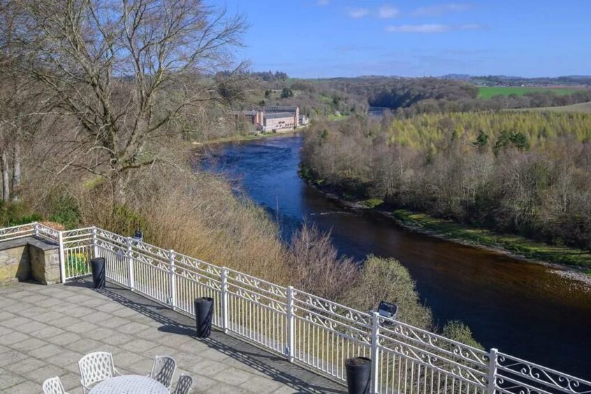 There is a terrace overlooking the River Tay.