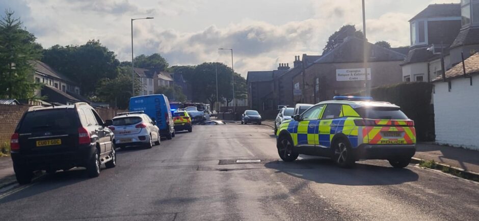 A Dundee priest is in recovery after a crash on Byron Street, pictured. 