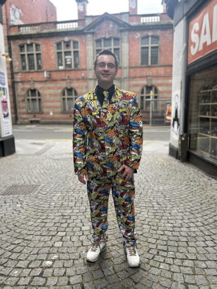 David Farry is rocking a colourful Beano and Dandy suit.