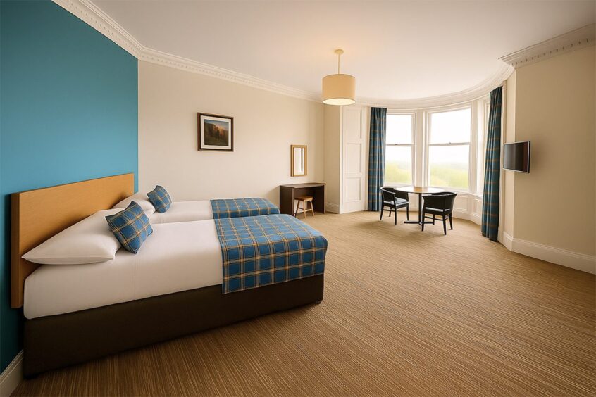 A bedroom at The Caledonian Thistle Hotel