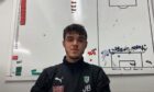Jordi Aluja in front of a tactics board.