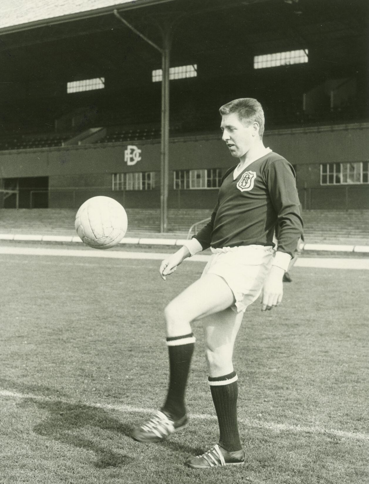 Alex Hamilton juggles the ball on the pitch at Dens Park