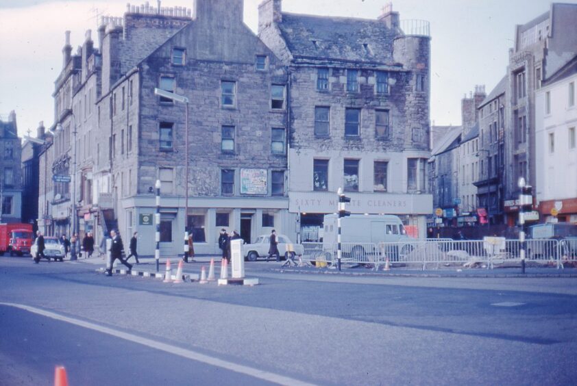 An undated view of the old Overgate, with people crossing the road