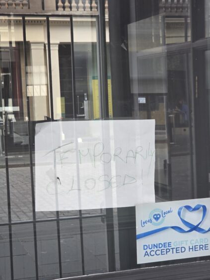 Pancake Place window with 'temporarily closed' sign 
