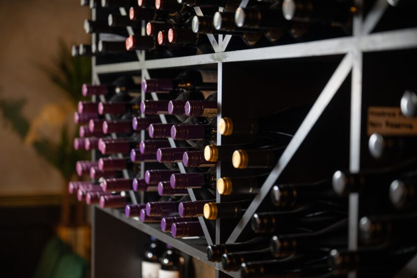 Lots of bottles of wine racked in 1876. 