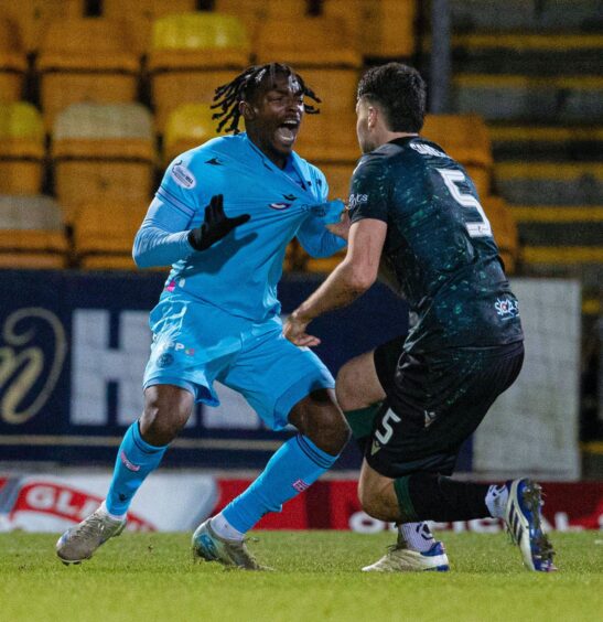 Jack Sanders grabs Toyosi Olusanya by the shirt. 
