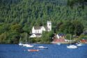 Kenmore Church with Loch tay and small boats in front