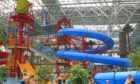 Pool with internal flumes and families playing in water