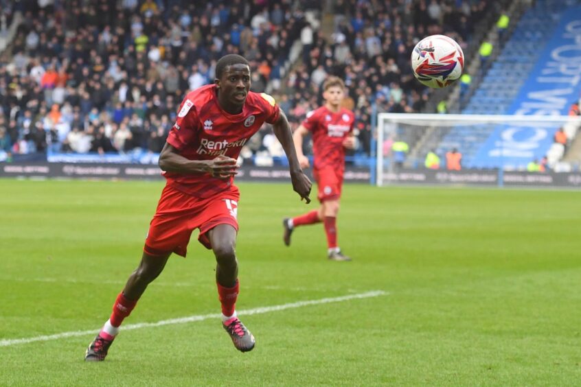 Panutche Camara hares after the ball during his time with Crawley.
