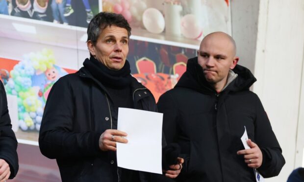 Simo Valakari and David Beaton in the stand at Hamilton before a game.