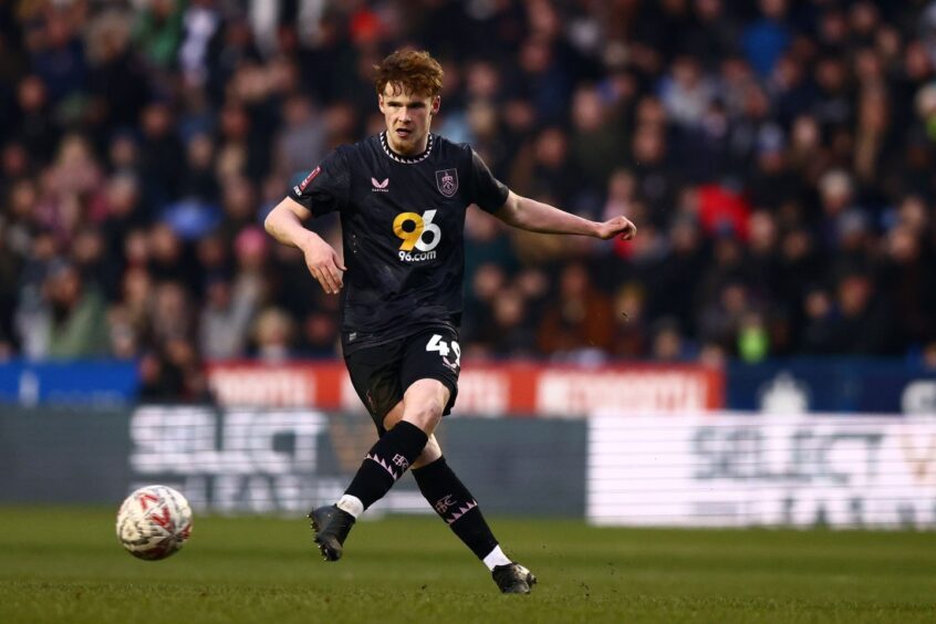 Tommy McDermott plays a pass.
