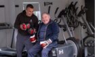 Chris Neilson helping a client keep mobile through boxing. Image: Chris Neilson