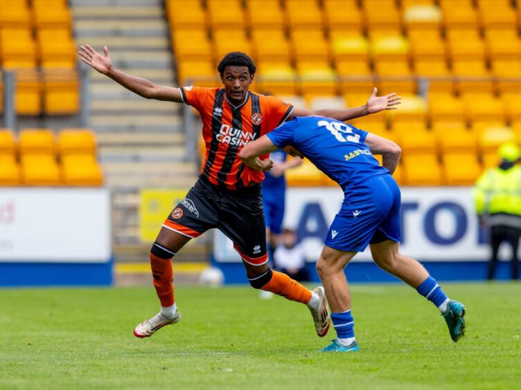 Amar Fatah is held by St Johnstone defender Jack Baird