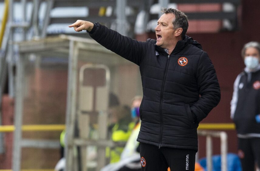 Micky Mellon dishes out instructions at an empty Tannadice.