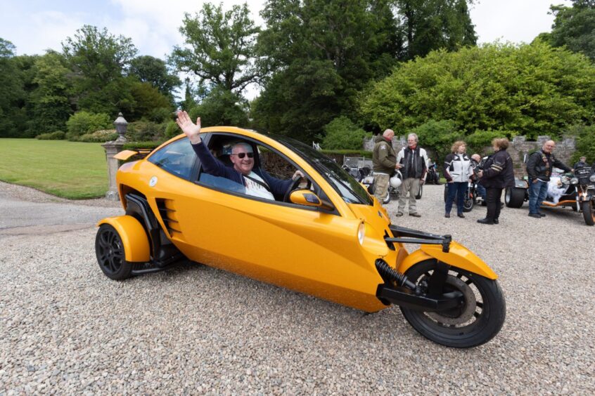 Scott Milne arrives in his orange Carver One at Brechin Castle during the 2025 Bike and Trike Fest in Angus.