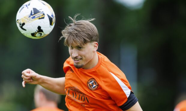 Straight into the action: Dundee United's Dario Naamo